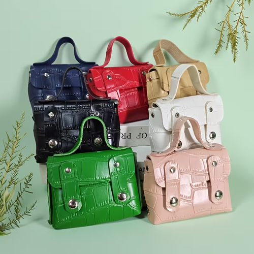 Mini crossbody briefcase purse in multiple colors — black, red, tan, white, green, and pink — croc-embossed faux leather with silver hardware