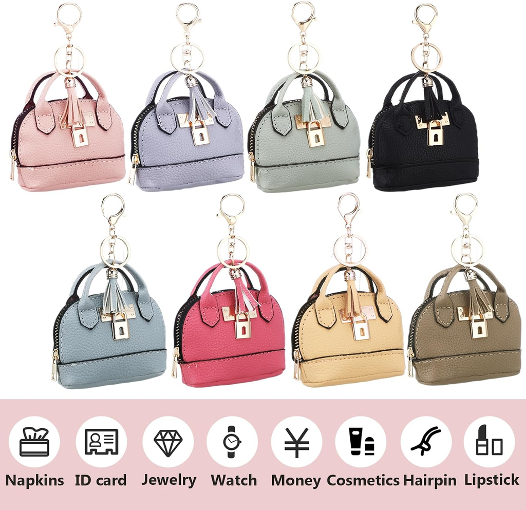 Set of small handbag keychains in various colors on a white background