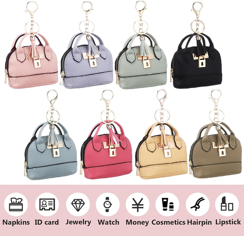 Set of small handbag keychains in various colors on a white background